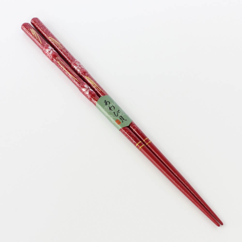 angled view red sakura ame chopsticks