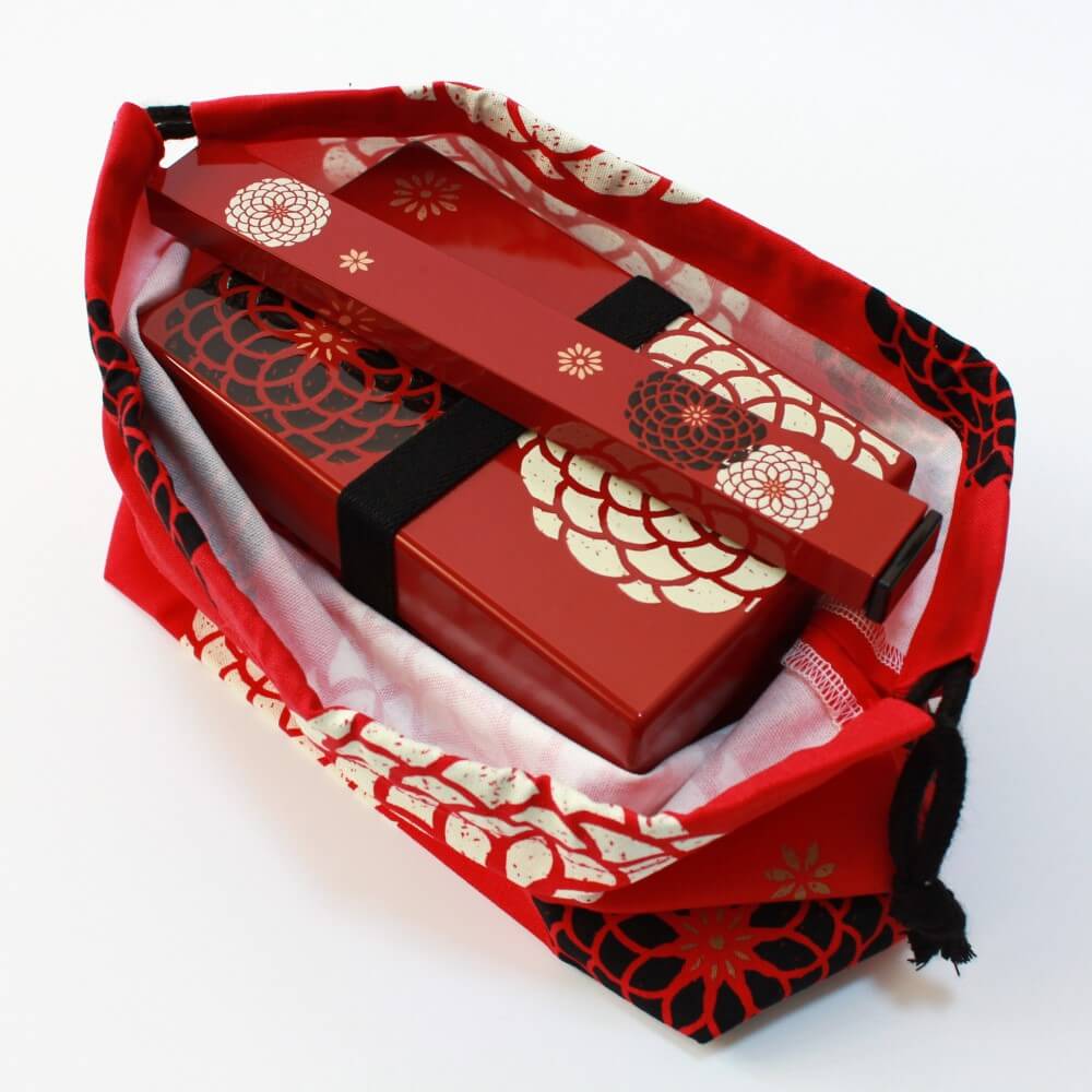 bento box chopsticks inside momoka red bento lunch bag