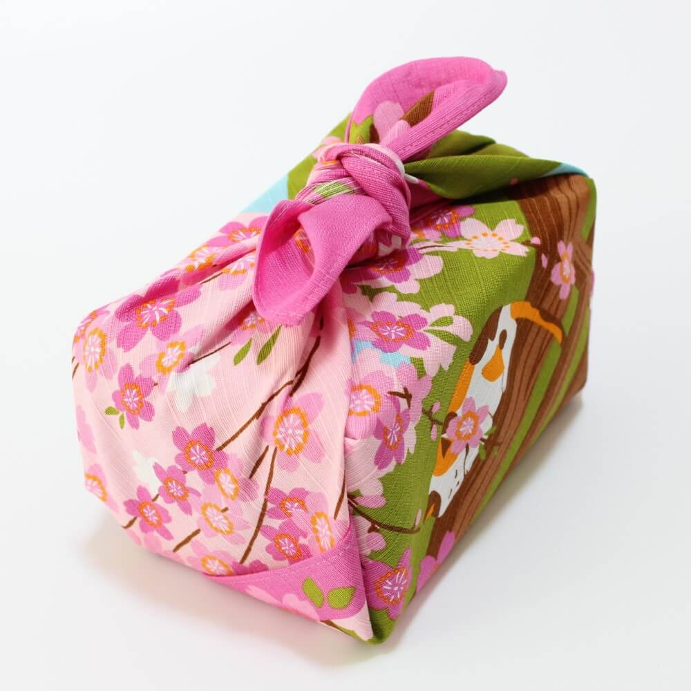 bento box wrapped in calico cat furoshiki pink