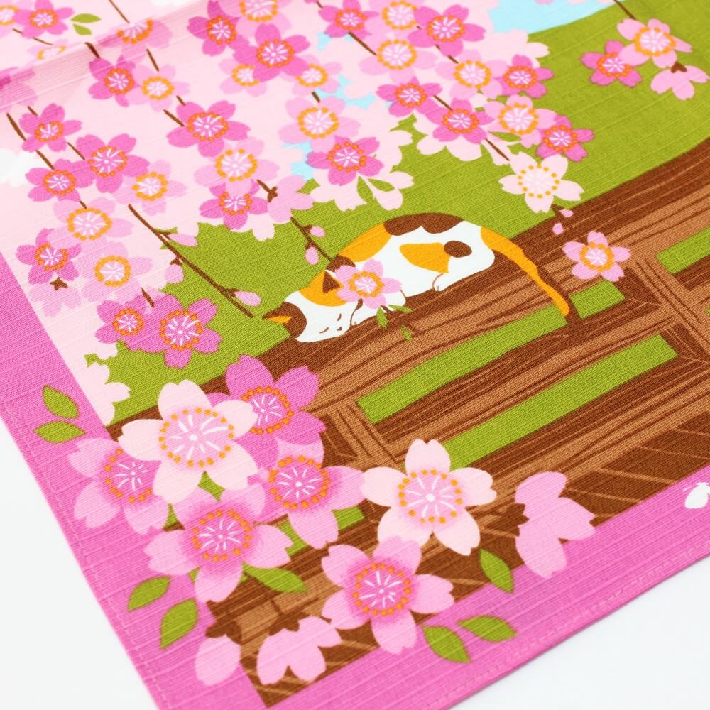 calico cat sleeping under flowers furoshiki