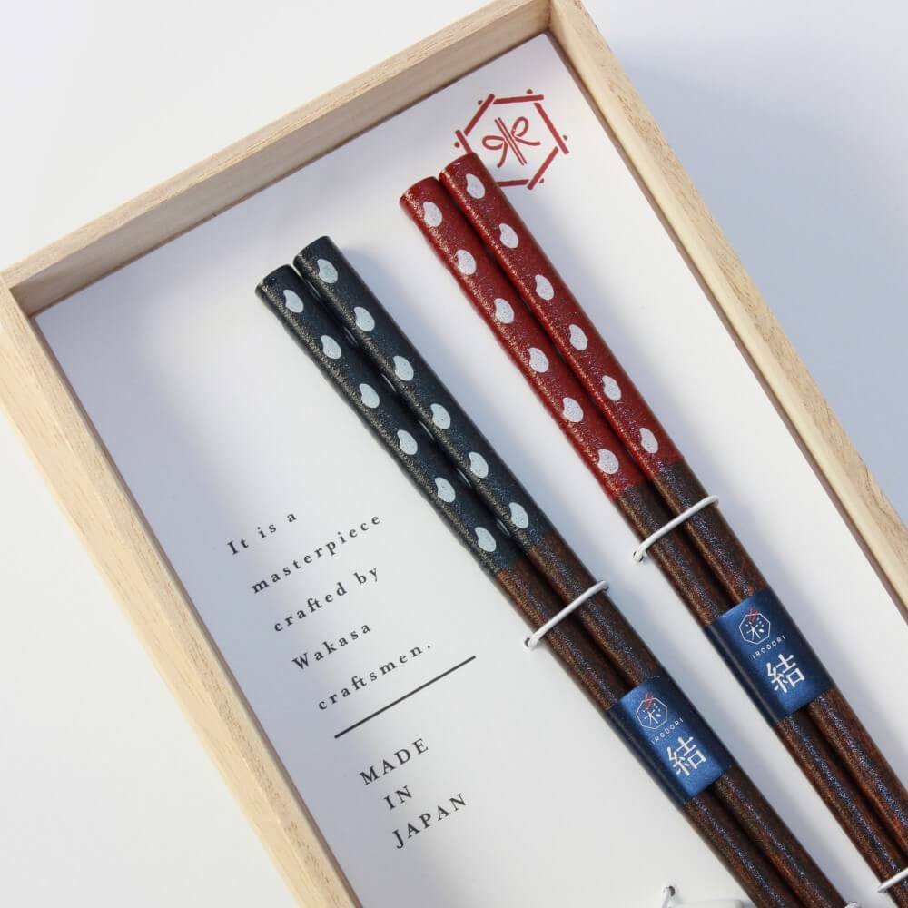 close up handles okome chopsticks inside box