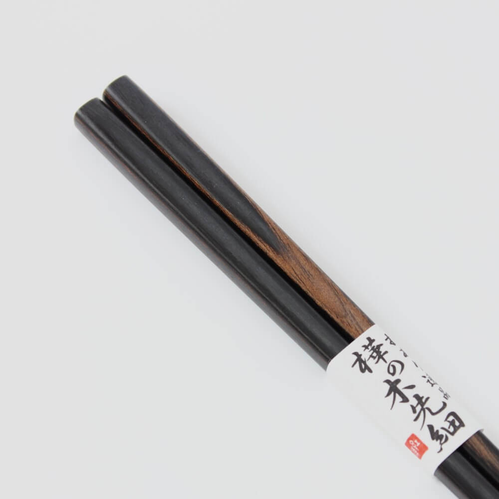 close up handles showing grains birch black chopsticks