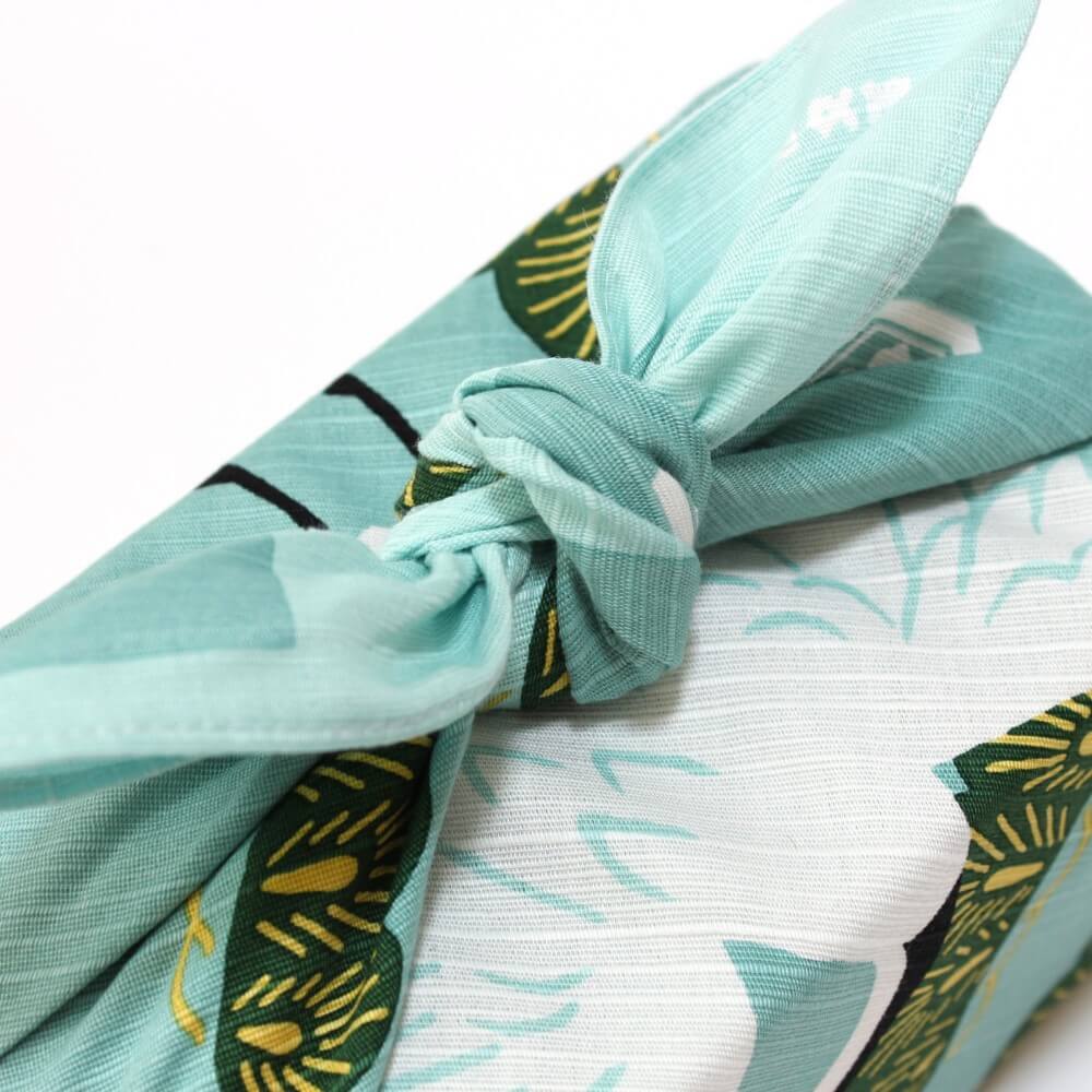 close up knot bento box wrapped dancing cranes furoshiki