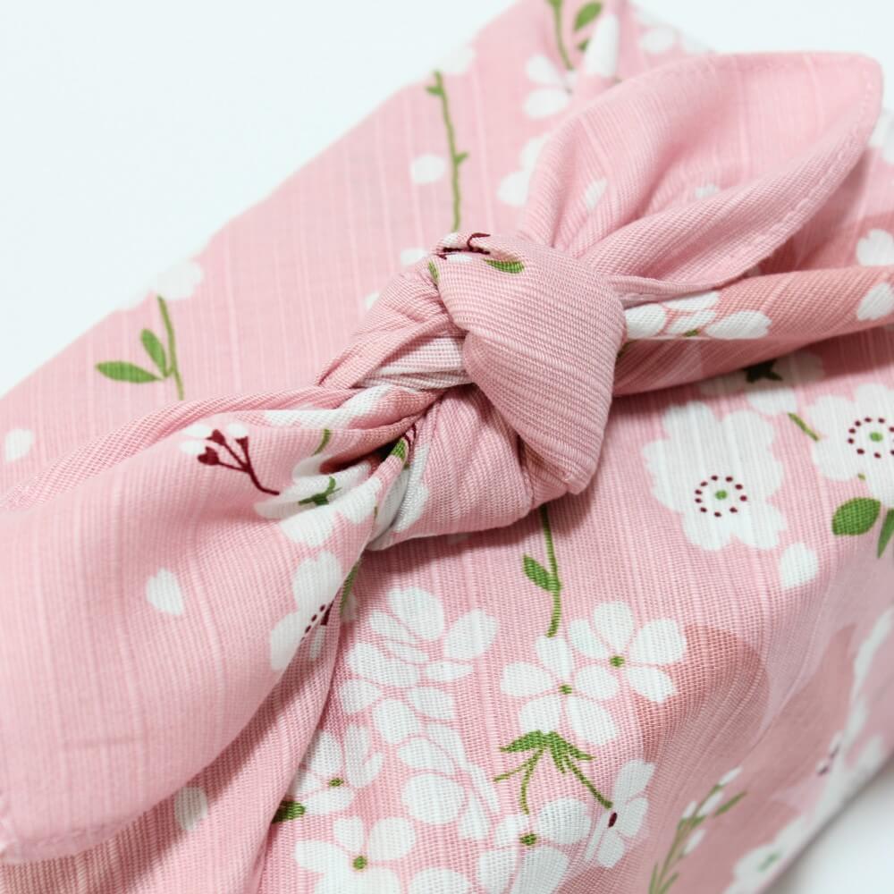 close up of the knot of spring sakura hama monyo furoshiki that is wrapped