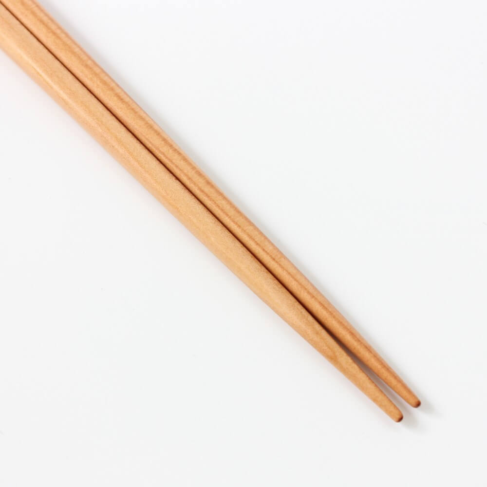 close up pointed tips of pine chopsticks