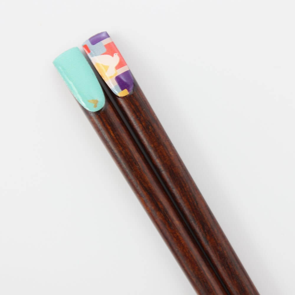 close up retro vintage canary chopsticks handles