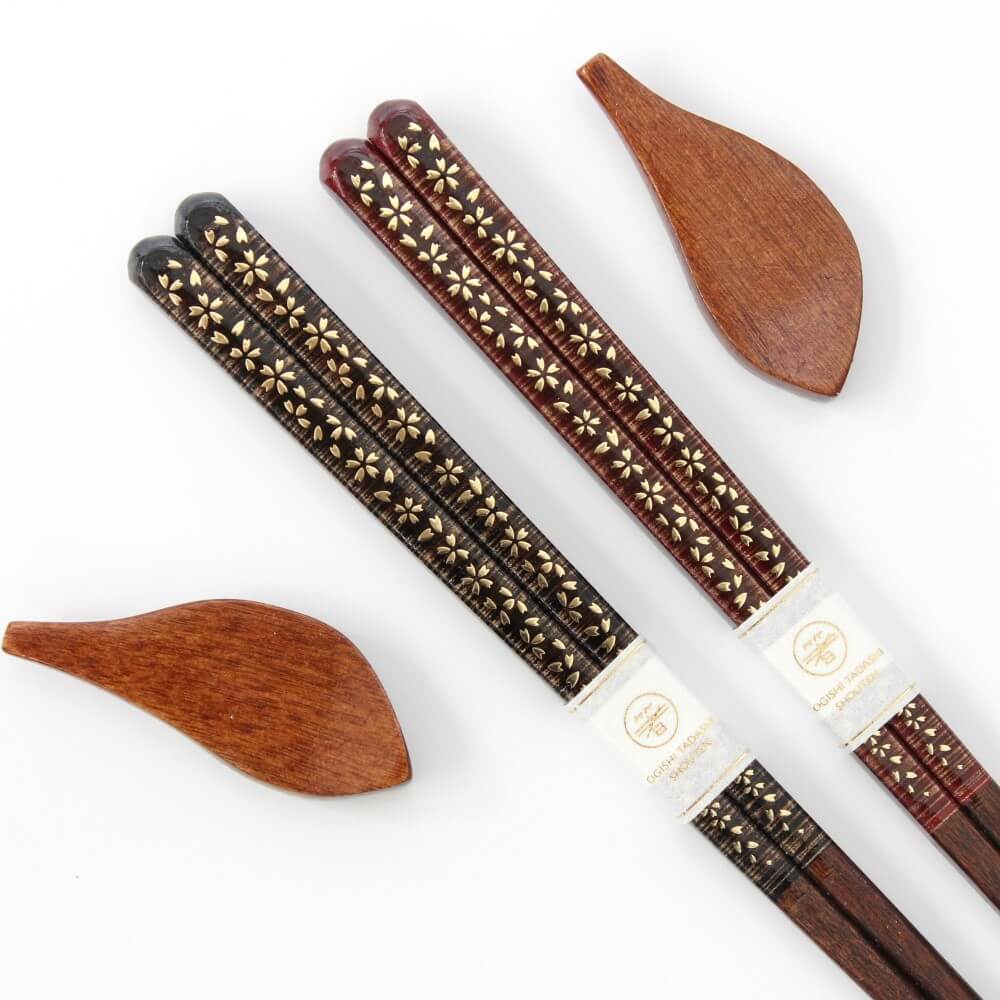 close up sakura gold chopsticks handles with rests 