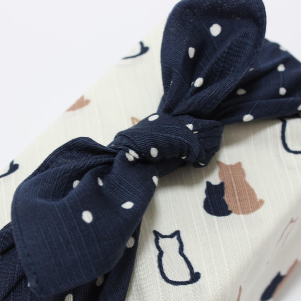 close up tied knot cat furoshiki