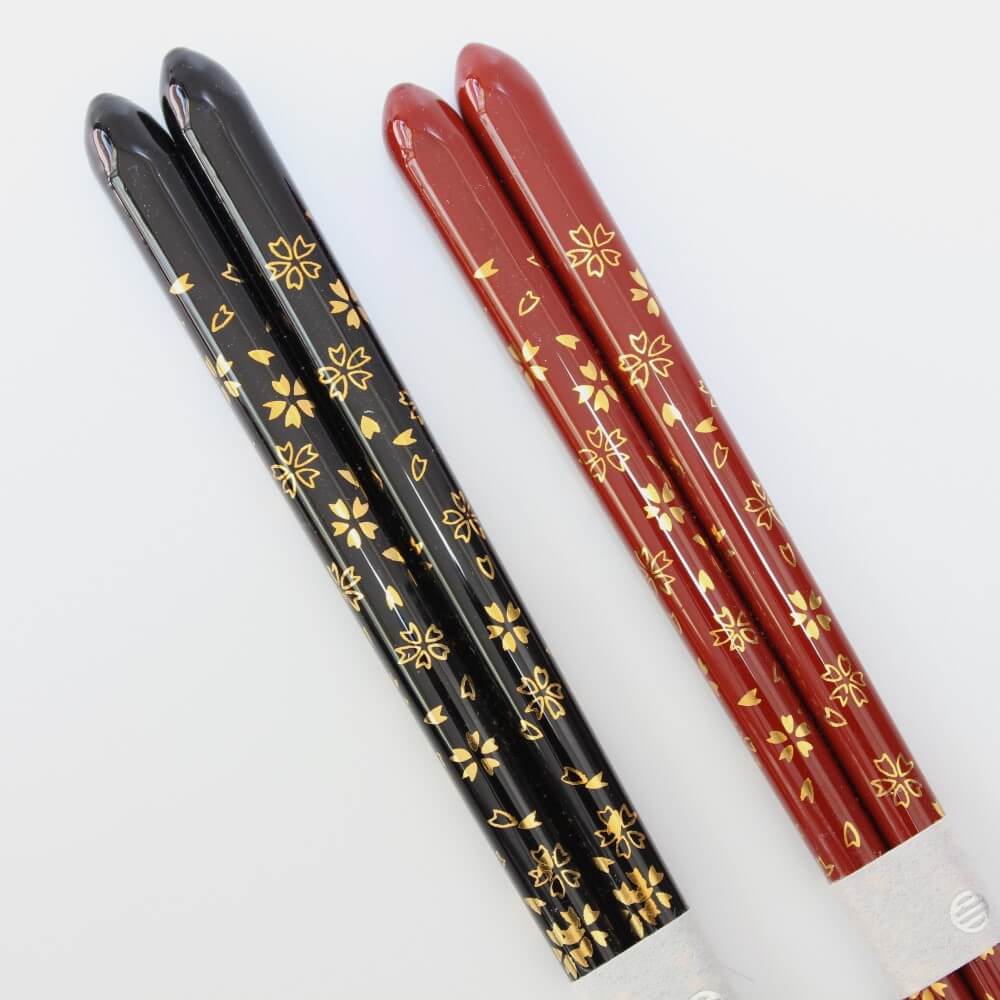 close up handles red black chopsticks