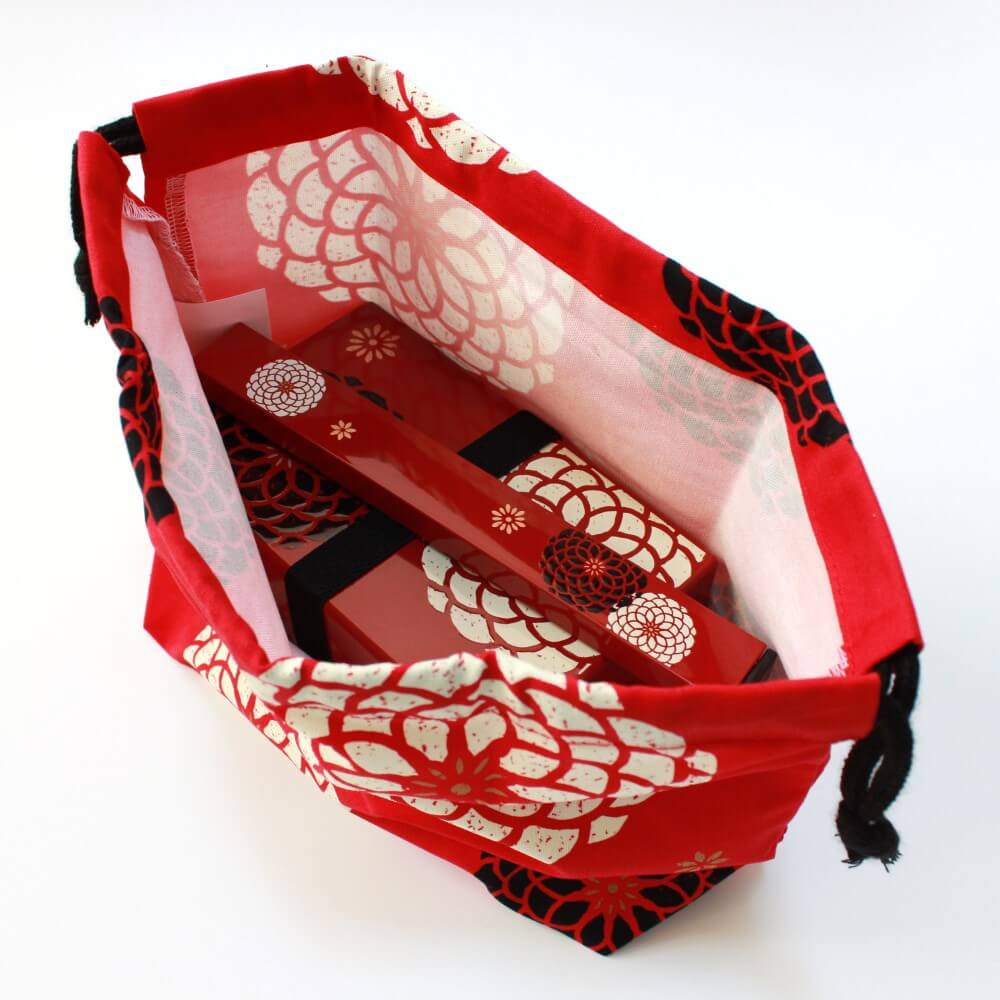 fully opened momoka red bag with bento box and chopsticks