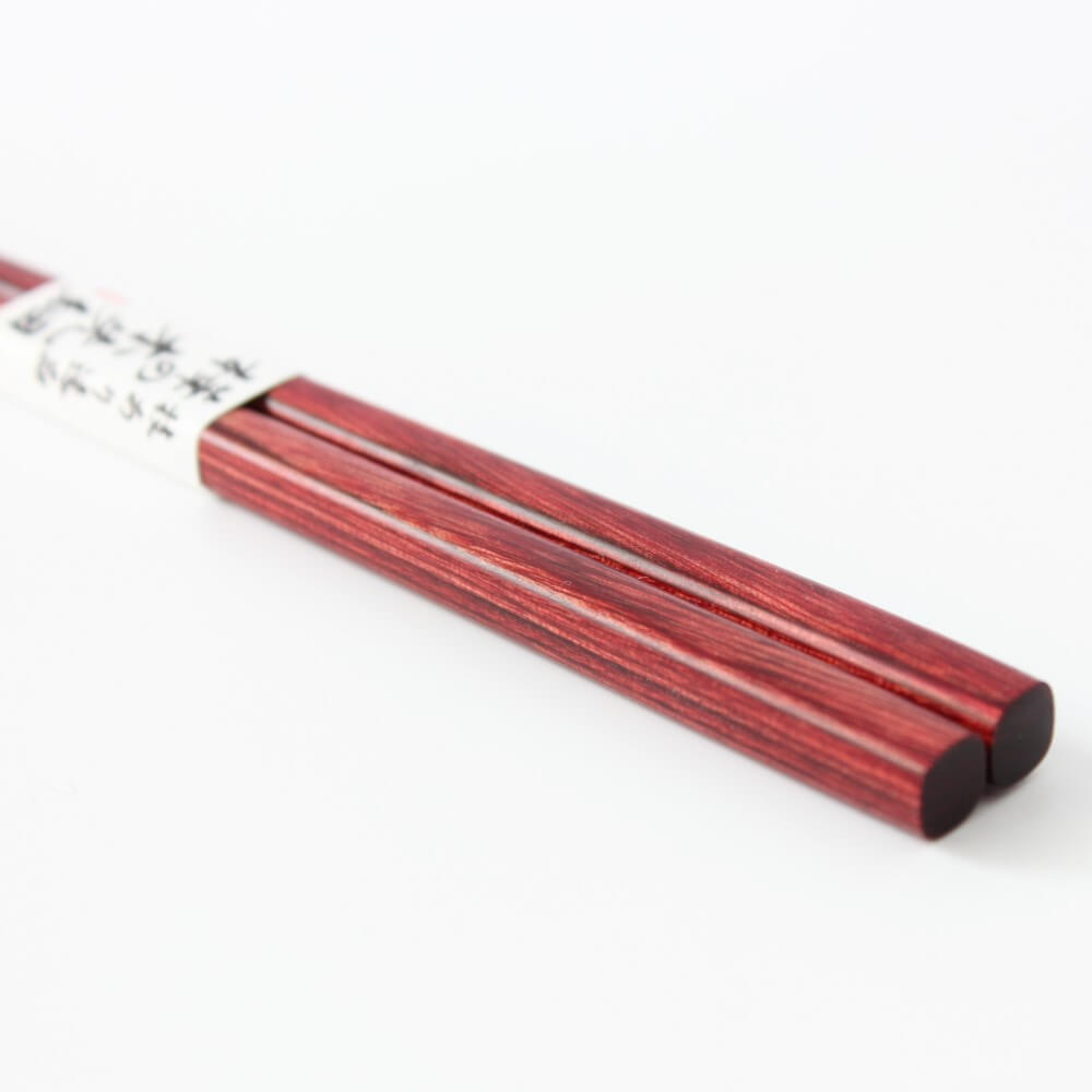 low angle close up handles kaba no ki red chopsticks