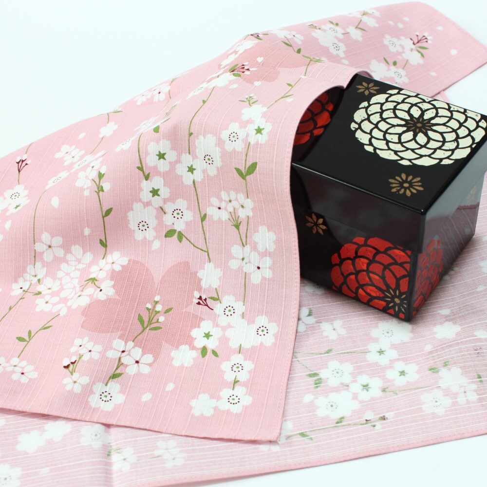 pink spring sakura furoshiki covering a black bento box