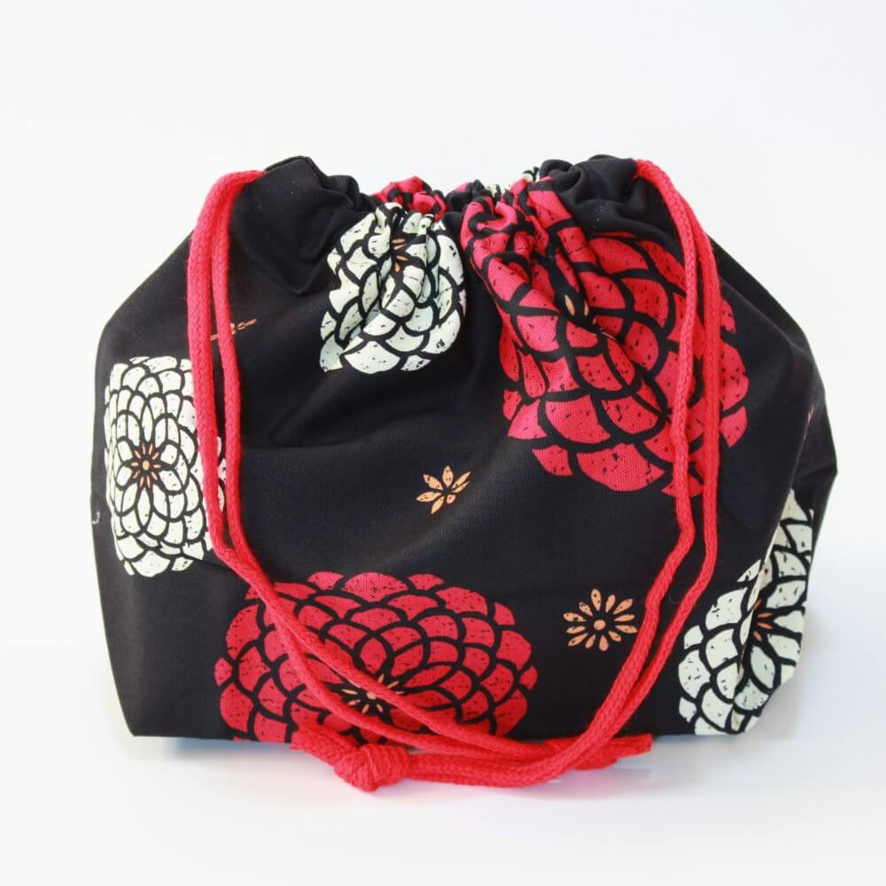 side profile of momoka black bento lunch bag kinchaku