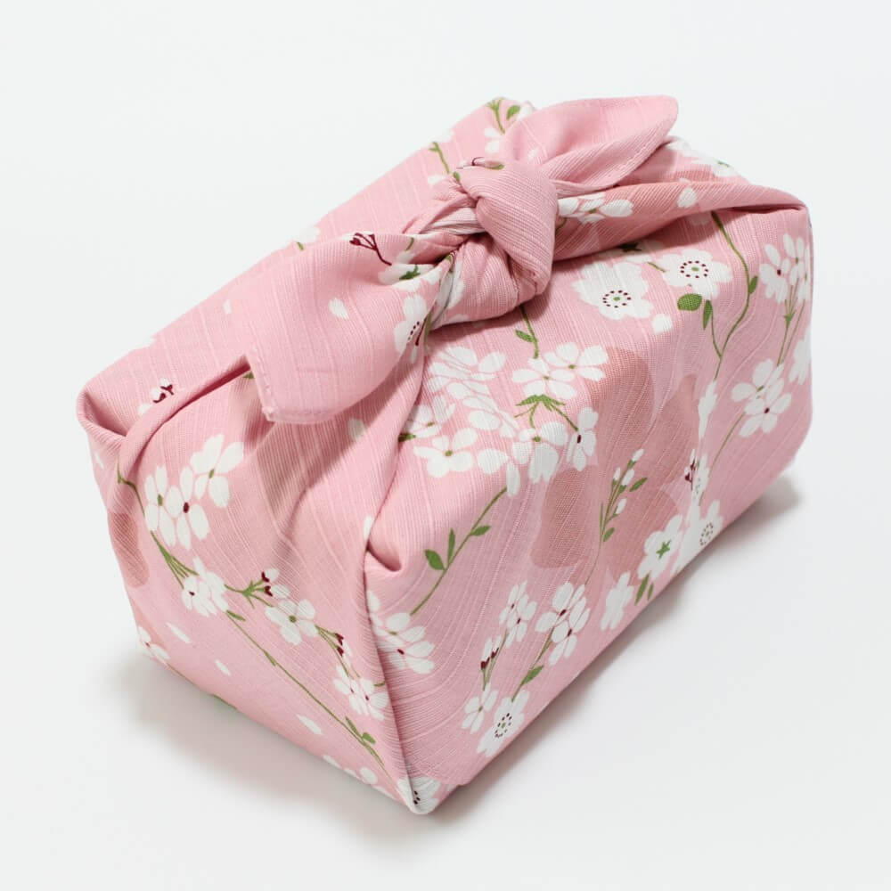 top of bento box wrapped in pink spring sakura furoshiki