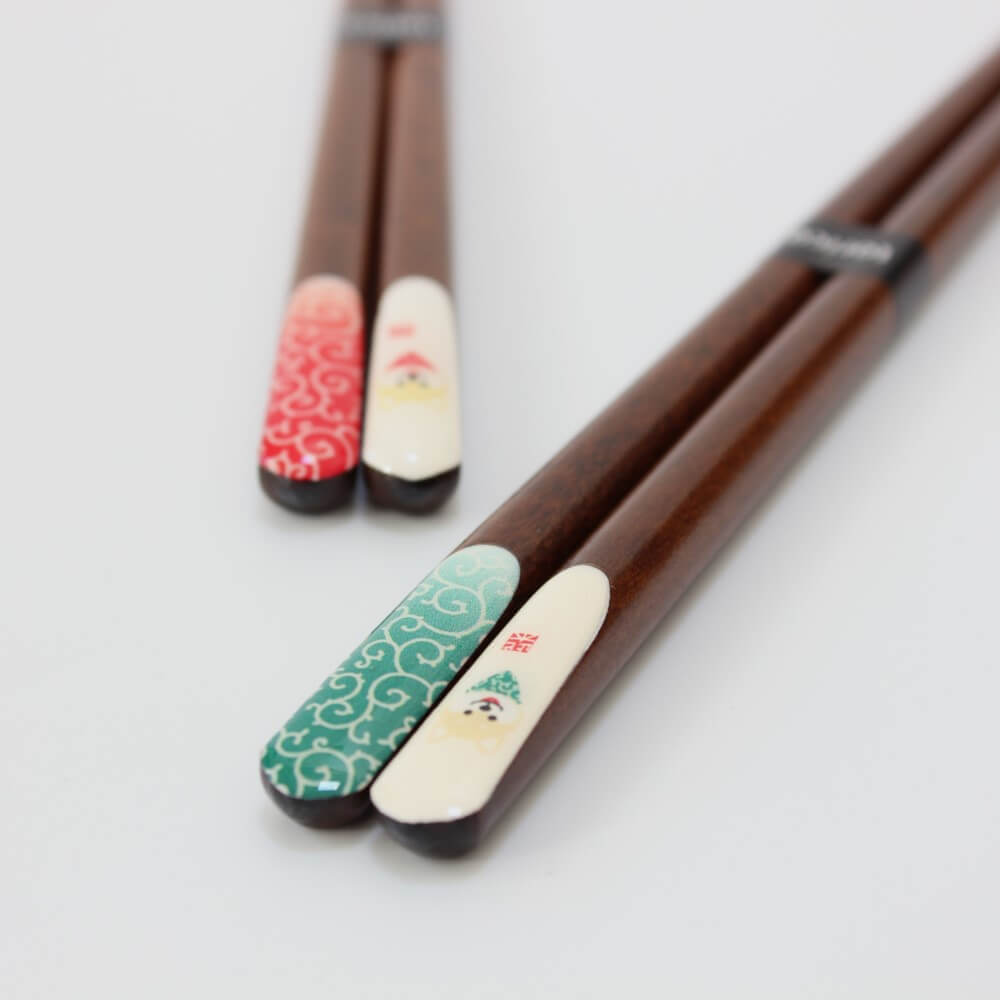 two shiba inu chopsticks angled shot