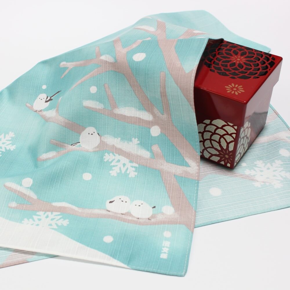 yuki asobi furoshiki covering a red bento box